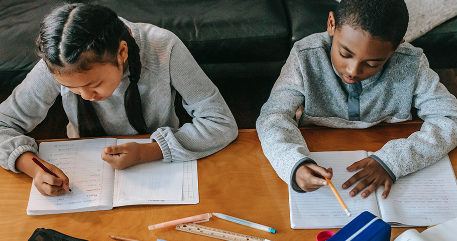 Effective IEP Goals for Your Student: What you Need to Know Now, image of two students sitting at the table doing homework.