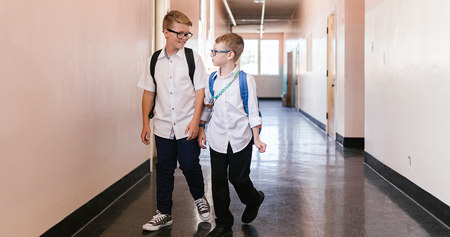 Can My Student Get An IEP In A Private School?, image of two kids in private school walking to class